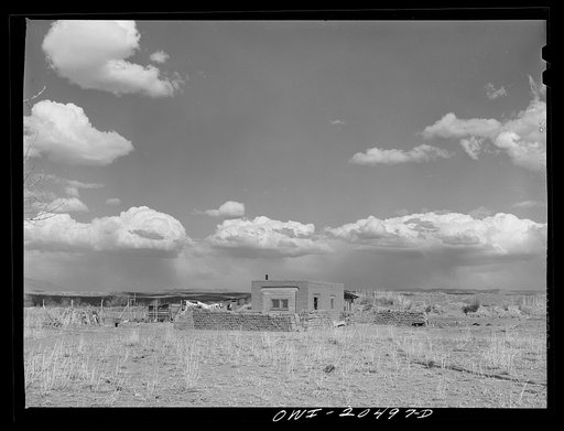 Isleta (vicinity), New Mexico. Indian adobe houses with adobe bricks drying in the sun