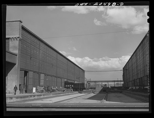 Albuquerque, New Mexico. Tender coming out of the Atchison, Topeka and Santa Fe Railroad locomotive shops on to the transfer table