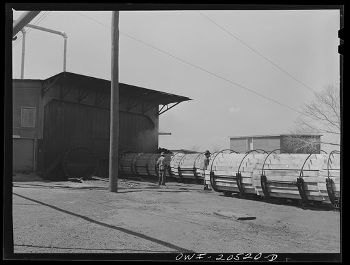 Untitled photo, possibly related to: Albuquerque, New Mexico. Ties going into a retort at the Atchison, Topeka and Santa Fe Railroad tie treating plant