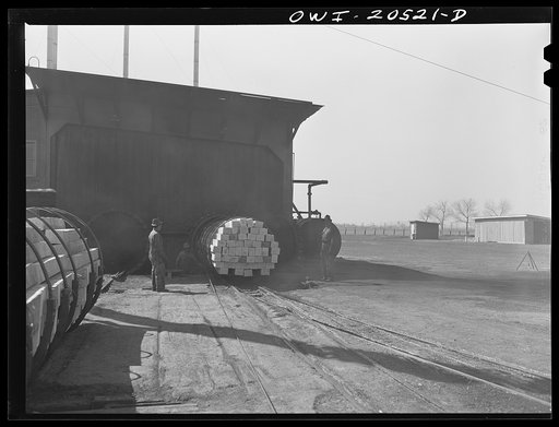 Untitled photo, possibly related to: Albuquerque, New Mexico. Ties going into a retort at the Atchison, Topeka and Santa Fe Railroad tie treating plant
