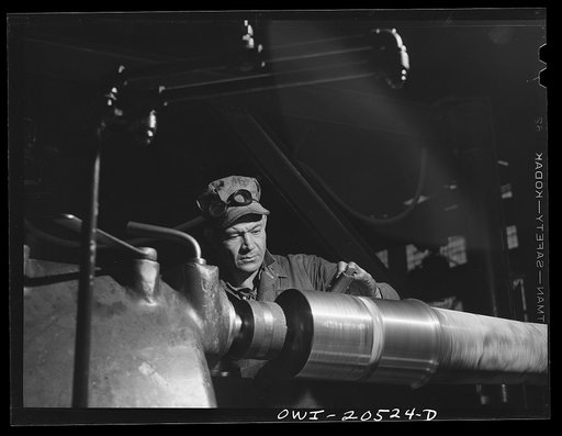 Albuquerque, New Mexico. Machinist George Mainz, working at an axle lathe in the Atchison, Topeka and Santa Fe Railroad shops