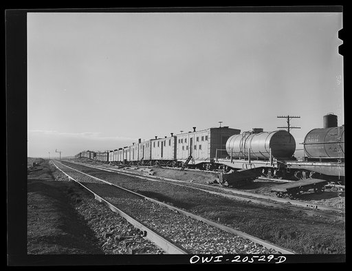 Iden, New Mexico. Atchison, Topeka and Santa Fe Railroad work train for a section gang. The tank cars hold water