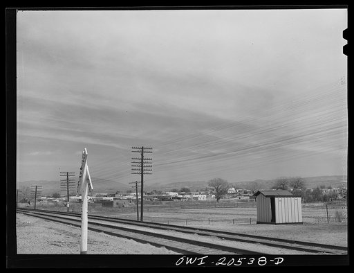 Isleta, New Mexico. Atchison, Topeka and Santa Fe Railroad line going to Albuquerque, New Mexico. In the background is the Indian reservation