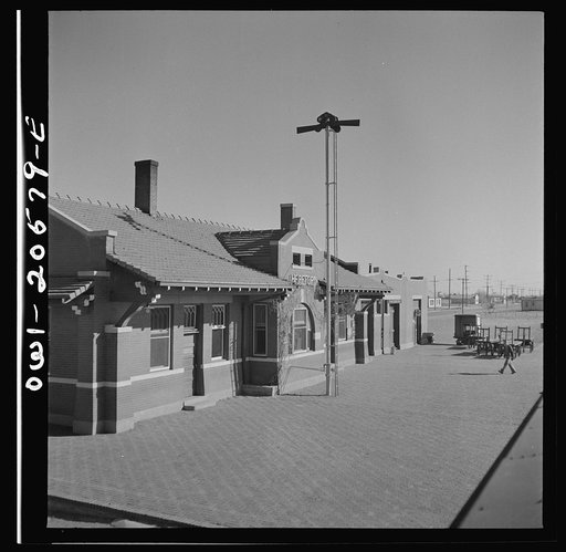 Hereford, Texas. Passing the depot on the Atchison, Topeka, and Santa Fe Railroad between Amarillo, Texas and Clovis, New Mexico