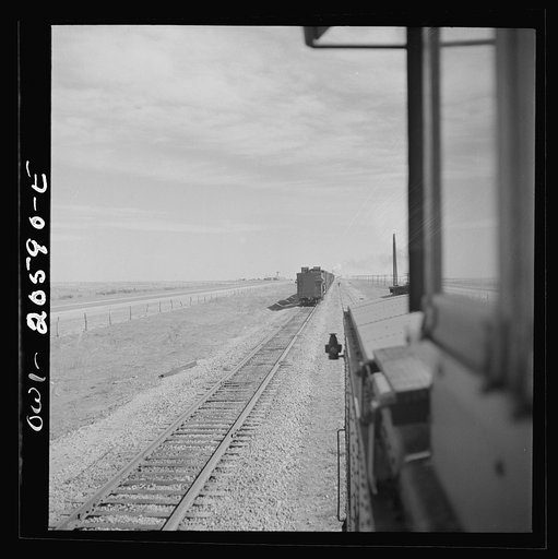 Parmerton, Texas. Passing an eastbound freight train on the Atchison, Topeka and Santa Fe Railroad between Amarillo, Texas and Clovis, New Mexico