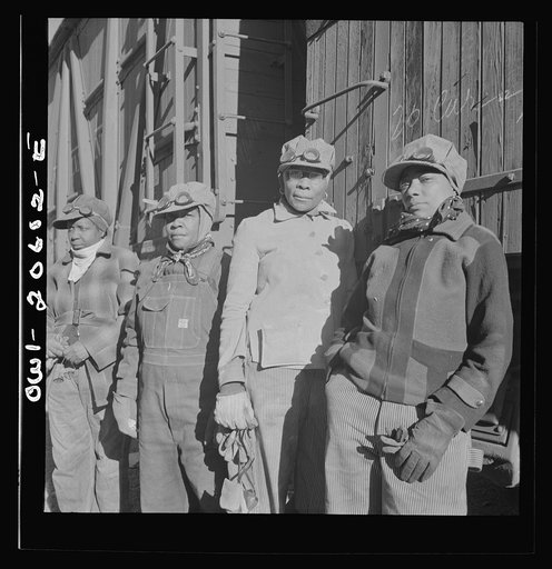Clovis, New Mexico. Women employed at the Atchison, Topeka and Santa Fe Railroad yard to clean out the potash jars. Left to right: Almeta Williams, Beatrice Davis, Liza Goss, and Abbie Caldwell