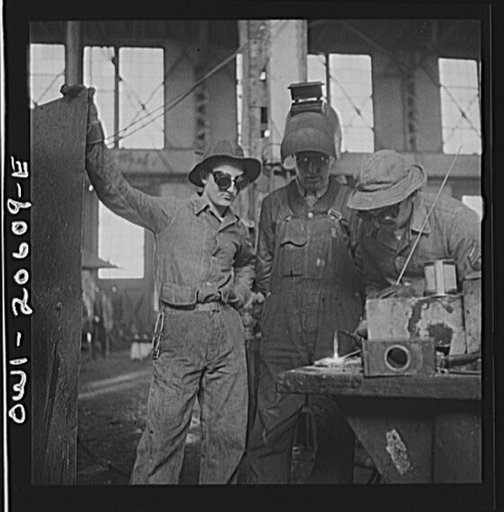 Clovis, New Mexico. Soldiers of the United States Army Railroad Battalion study welding at the locomotive ships in the Atchison, Topeka and Santa Fe Railroad. Left to right: Private Edward Dravis of Minnesota; Earl Weidinger, instructor and welder; and Sergeant Arthur Cannon of Indiana