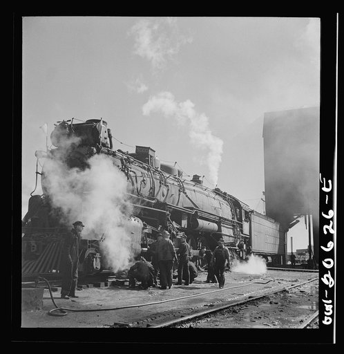 Clovis, New Mexico. Checking a locomotive as it leaves the roundhouse in the Atchison, Topeka and Santa Fe Railroad shops