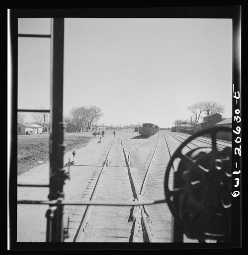 Clovis, New Mexico. Pulling out of the Atchison, Topeka and Santa Fe Railroad yard
