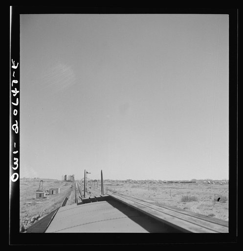 Untitled photo, possibly related to: Fort Sumner, New Mexico. Train about to cross Pecos River along the Atchison, Topeka, and Santa Fe Railroad between Clovis and Vaughn, New Mexico