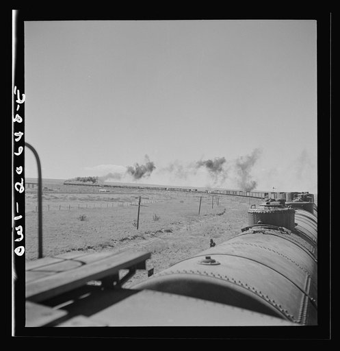 Untitled photo, possibly related to: Fort Sumner, New Mexico. Train about to cross Pecos River along the Atchison, Topeka, and Santa Fe Railroad between Clovis and Vaughn, New Mexico
