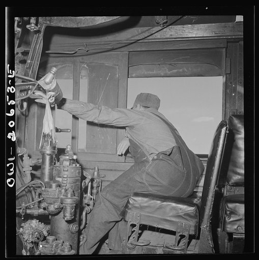 Ricardo, New Mexico. Engineer in his cab about to start the train along the Atchison, Topeka, and Santa Fe Railroad between Clovis and Vaughn, New Mexico