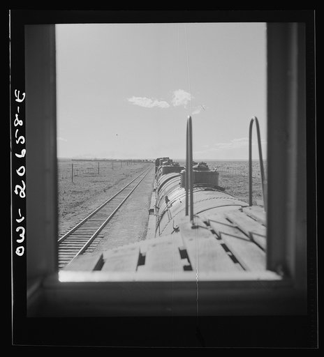 Untitled photo, possibly related to: Yeso, New Mexico. Rounding a curve along the Atchison, Topeka, and Santa Fe Railroad between Clovis and Vaughn, New Mexico