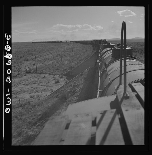 Untitled photo, possibly related to: Yeso, New Mexico. Rounding a curve along the Atchison, Topeka, and Santa Fe Railroad between Clovis and Vaughn, New Mexico