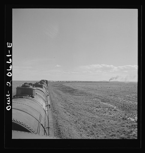 Untitled photo, possibly related to: Buchanan, New Mexico. Rounding a long curve approaching the town along the Atchison, Topeka, and Santa Fe Railroad between Clovis and Vaughn, New Mexico