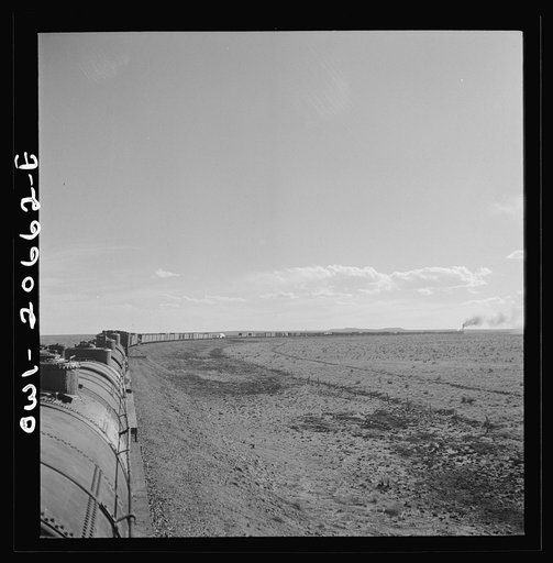 Buchanan, New Mexico. Rounding a long curve approaching the town along the Atchison, Topeka, and Santa Fe Railroad between Clovis and Vaughn, New Mexico