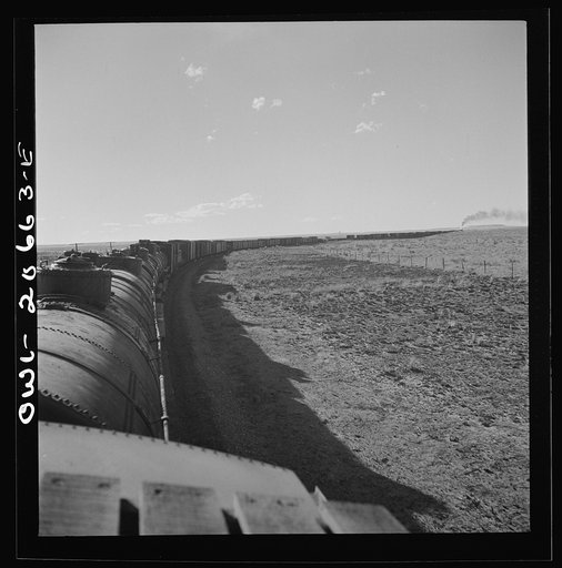Untitled photo, possibly related to: Buchanan, New Mexico. Rounding a long curve approaching the town along the Atchison, Topeka, and Santa Fe Railroad between Clovis and Vaughn, New Mexico