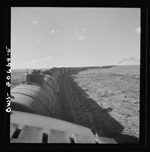 Untitled photo, possibly related to: Buchanan, New Mexico. Rounding a long curve approaching the town along the Atchison, Topeka, and Santa Fe Railroad between Clovis and Vaughn, New Mexico