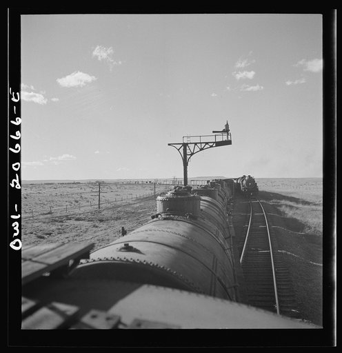 Buchanan, New Mexico. Passing an eastbound freight along the Atchison, Topeka, and Santa Fe Railroad between Clovis and Vaughn, New Mexico