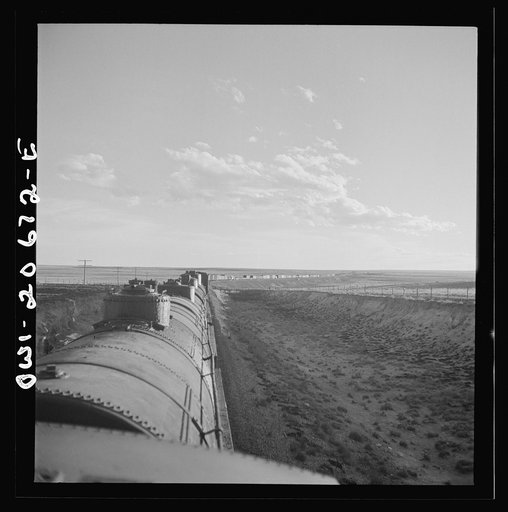 Untitled photo, possibly related to: Duoro, New Mexico. Rounding a curve in the sheep and cattle country along the Atchison, Topeka, and Santa Fe Railroad between Clovis and Vaughn, New Mexico