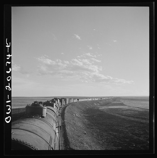 Untitled photo, possibly related to: Duoro, New Mexico. Rounding a curve in the sheep and cattle country along the Atchison, Topeka, and Santa Fe Railroad between Clovis and Vaughn, New Mexico