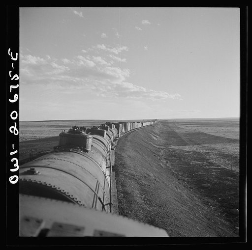 Untitled photo, possibly related to: Duoro, New Mexico. Rounding a curve in the sheep and cattle country along the Atchison, Topeka, and Santa Fe Railroad between Clovis and Vaughn, New Mexico