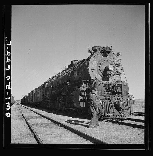 Untitled photo, possibly related to: Vaughn, New Mexico. Easternbound train about to leave the Atchison, Topeka and Santa Fe Railroad yard on the return trip