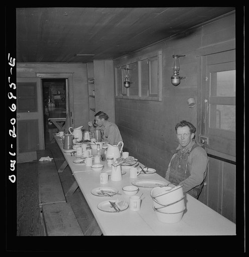 Iden, New Mexico. The last few workers have breakfast in the dining car of work train on the Atchison, Topeka and Santa Fe yard, between Clovis and Vaughn, New Mexico