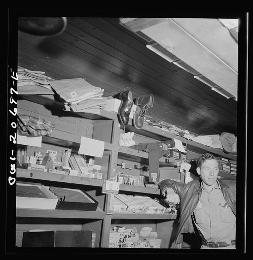 Iden, New Mexico. In the commissary car of a work train on the Atchison, Topeka and Santa Fe Railroads. The clerk is J.E. Straight of Newton, Kansas