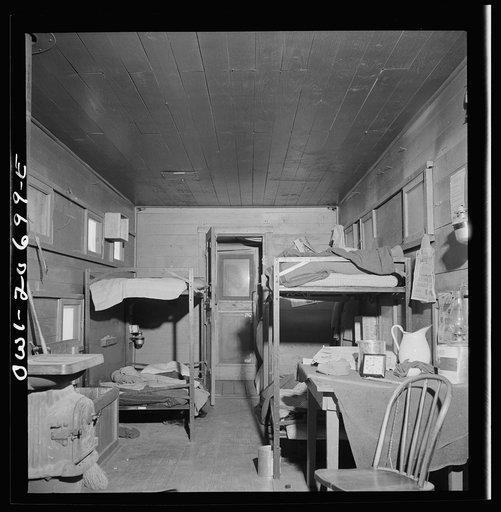 Untitled photo, possibly related to: Iden, New Mexico. One of the bunk cars for section workers of a train on the Atchison, Topeka and Santa Fe Railroad between Clovis and Vaughn, New Mexico