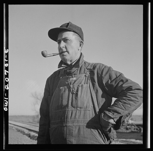Vaughn, New Mexico. Conductor's chair in a caboose on the Atchison, Topeka and Santa Fe Railroad. Glass rollers on the legs are old, insulators from the telephone lines