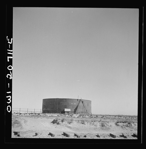 Vaughn, New Mexico. Oil storage tanks at the Atchison, Topeka and Santa Fe Railroad yard