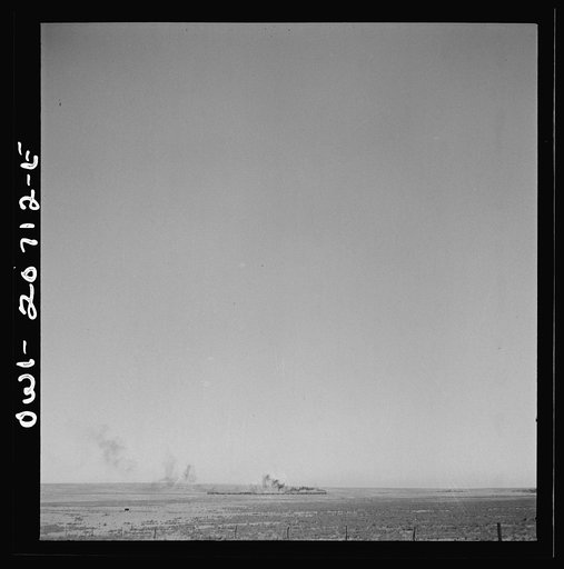 Untitled photo, possibly related to: Vaughn, New Mexico. A train on the Atchison, Topeka and Santa Fe Railroad passing a Southern Pacific Railroad freight train as it was leaving between Vaughn and Belen, New Mexico