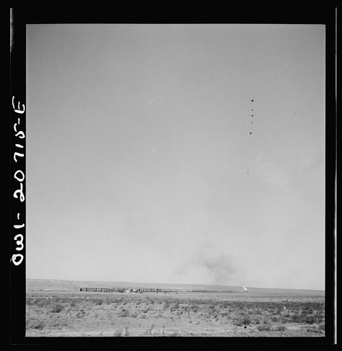 Vaughn, New Mexico. A train on the Atchison, Topeka and Santa Fe Railroad passing a Southern Pacific Railroad freight train as it was leaving between Vaughn and Belen, New Mexico