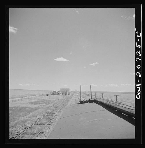 Untitled photo, possibly related to: Encino, New Mexico. Passing a section house along the Atchison, Topeka and Santa Fe Railroad between Vaughn and Belen, New Mexico