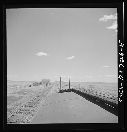 Encino, New Mexico. Passing a section house along the Atchison, Topeka and Santa Fe Railroad between Vaughn and Belen, New Mexico