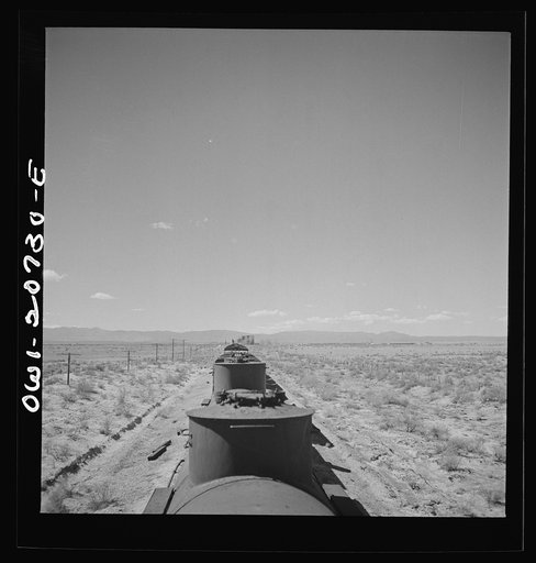 Untitled photo, possibly related to: Willard, New Mexico. Stopping for water along the Atchison, Topeka and Santa Fe Railroad between Vaughn and Belen, New Mexico