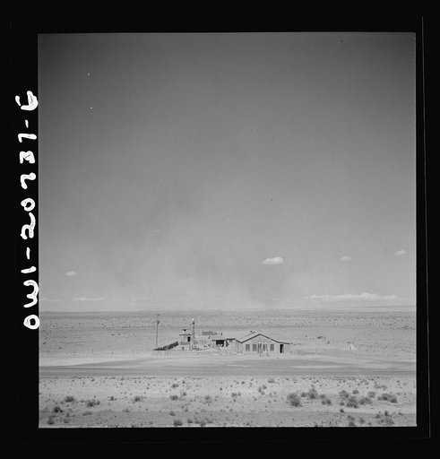 Willard, New Mexico. Passing a filling station in the desert country along the Atchison, Topeka and Santa Fe Railroad between Vaughn and Belen, New Mexico