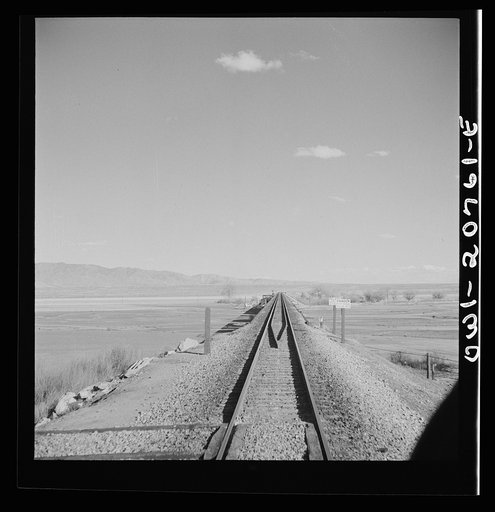 Belen, New Mexico. Going across the Rio Grande River Valley on the Atchison, Topeka and Santa Fe Railroad between Vaughn and Belen, New Mexico. There is a drop of over 1600 feet in elevation