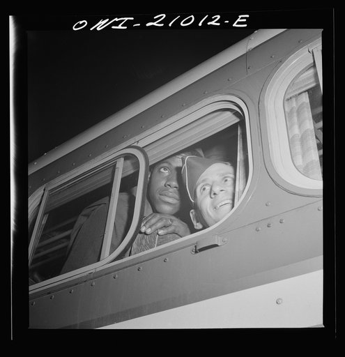 Washington, D.C. Soldiers looking out the window of the bus just before leaving the Greyhound terminal