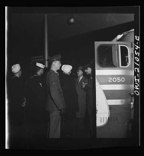 Untitled photo, possibly related to: Washington, D.C. Boarding a special bus for servicemen. Leaving the Greyhound terminal on Sunday nightl