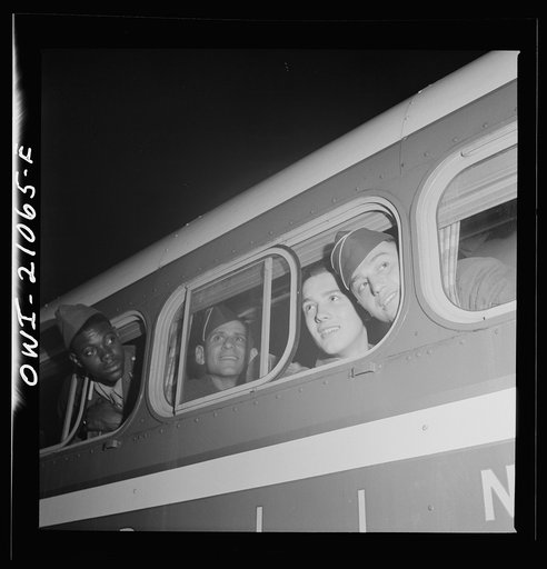 Washington, D.C. Soldiers looking out the window of the bus just before leaving the Greyhound terminal