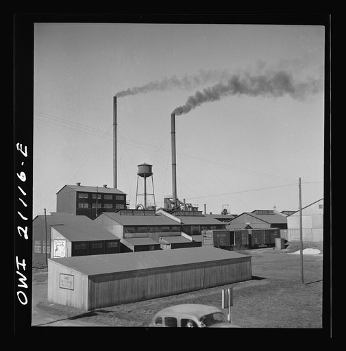 Pampa (vicinity), Texas. Passing a carbon black plant along the Atchison, Topeka and Santa Fe Railroad between Canadian and Amarillo, Texas