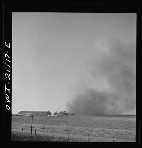 Pampa (vicinity), Texas. Passing a carbon black plant along the Atchison, Topeka and Santa Fe Railroad between Canadian and Amarillo, Texas