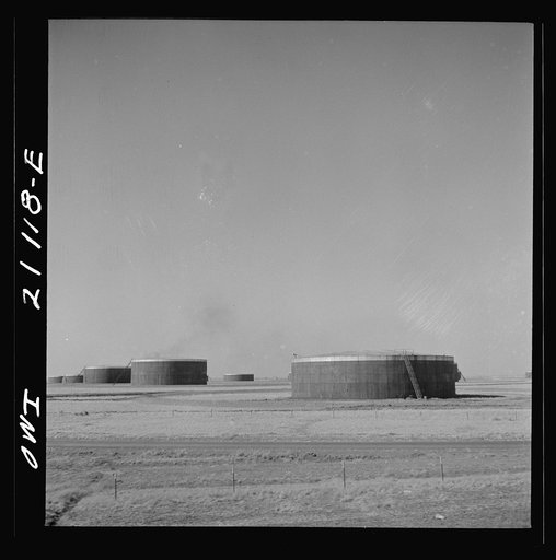 Untitled photo, possibly related to: Pampa (vicinity), Texas. An oil storage tank along the Atchison, Topeka and Santa Fe Railroad between Canadian and Amarillo, Texas
