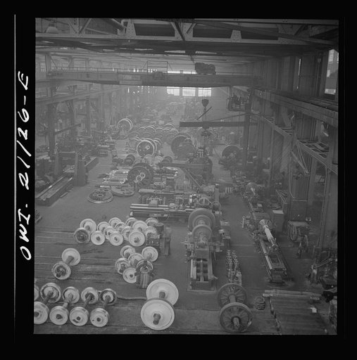 Untitled photo, possibly related to: Albuquerque, New Mexico. In the wheel shop of the Atchison, Topeka and Santa Fe Railroad shop