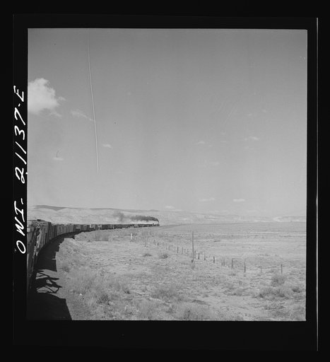 Quirk (vicinity), New Mexico. A train rounding a curve along the Atchison, Topeka and Santa Fe Railroad between Belen and Gallup, New Mexico
