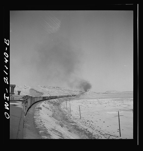 Quirk (vicinity), New Mexico. A train rounding a curve along the Atchison, Topeka and Santa Fe Railroad between Belen and Gallup, New Mexico