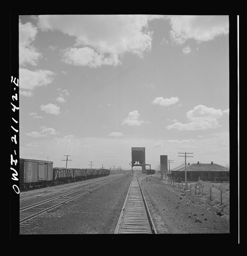 Untitled photo, possibly related to: Quirk (vicinity), New Mexico. Going through the town along the Atchison, Topeka and Santa Fe Railroad between Belen and Gallup, New Mexico