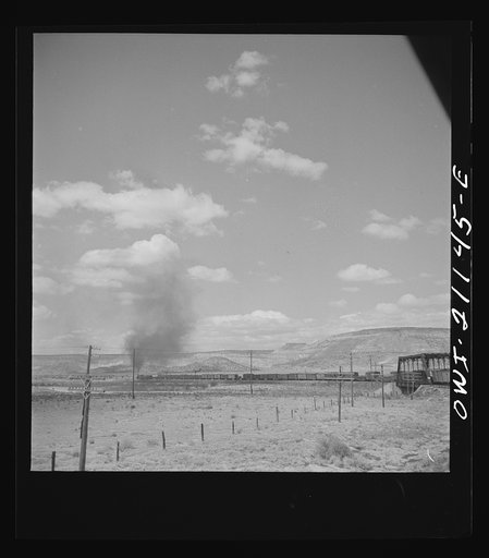 Laguna (vicinity), New Mexico. A train going around a curve along the Atchison, Topeka and Santa Fe Railroad between Belen and Gallup, New Mexico